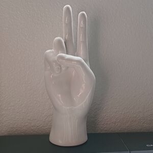 Peaceful hand gesture statue
